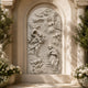 Arch-topped marble Annunciation relief shown on a tall interior wall