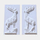 White marble relief panel 150cm with a standing stag on rocky ground, antlers cut free
