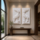 Two mirrored marble stag relief panels shown hung as a facing pair above a console