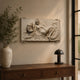 Reclining nude marble relief panel shown above a bedroom headboard