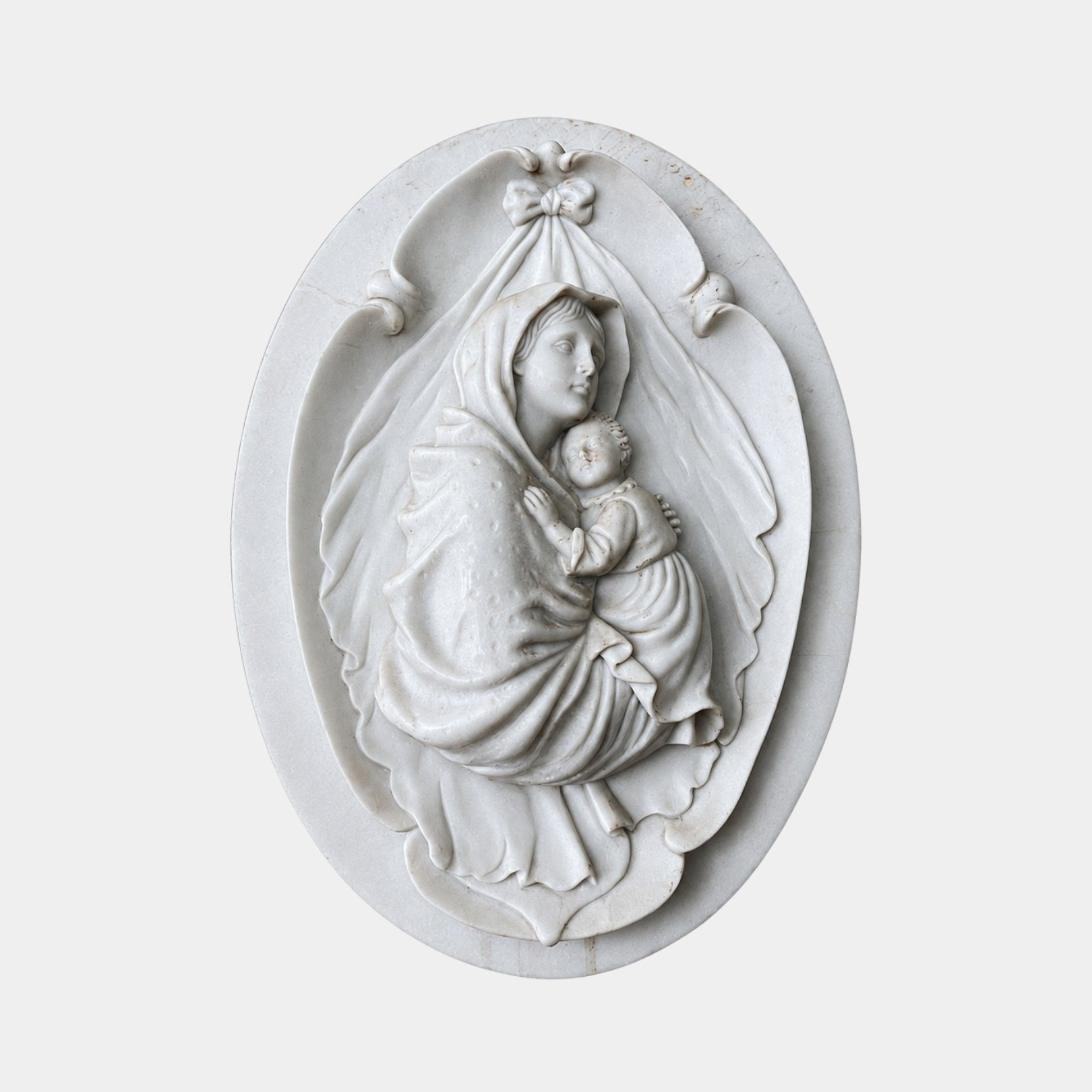 White marble oval plaque 60cm with a veiled Madonna holding the sleeping Child
