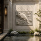 Carp and coral marble relief panel shown on a pool house wall