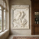 Rider on a rearing horse marble relief panel shown above a fireplace