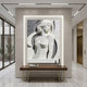 Art Deco two-tone marble relief shown on a plain lobby wall