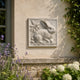 Hare and blackberries marble relief panel shown on a garden room wall