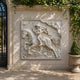 Mounted warrior marble relief panel shown on a stair hall wall