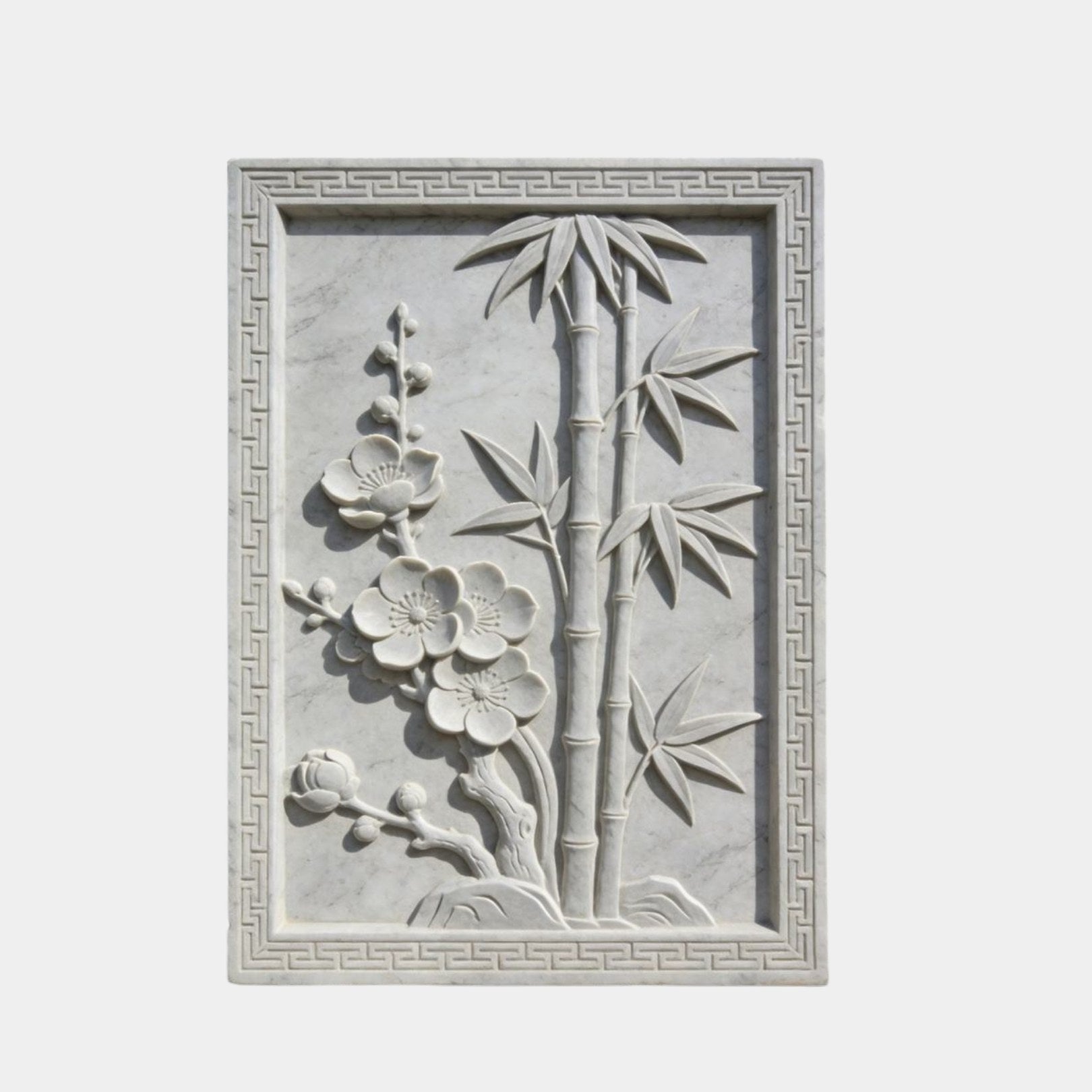 White marble relief 150cm with plum blossom and bamboo in a Chinese fret border