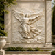 Ascending angel cream marble relief shown high on a stairwell wall
