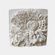 Marble relief of one chrysanthemum bloom filling the panel, petals in courses