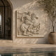 Classical horseman stone relief panel shown on a country hallway wall