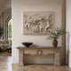 Marble putti and garland relief shown wall-mounted above a carved stone console