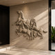 Marble galloping horse group shown fixed to a travertine-clad wall