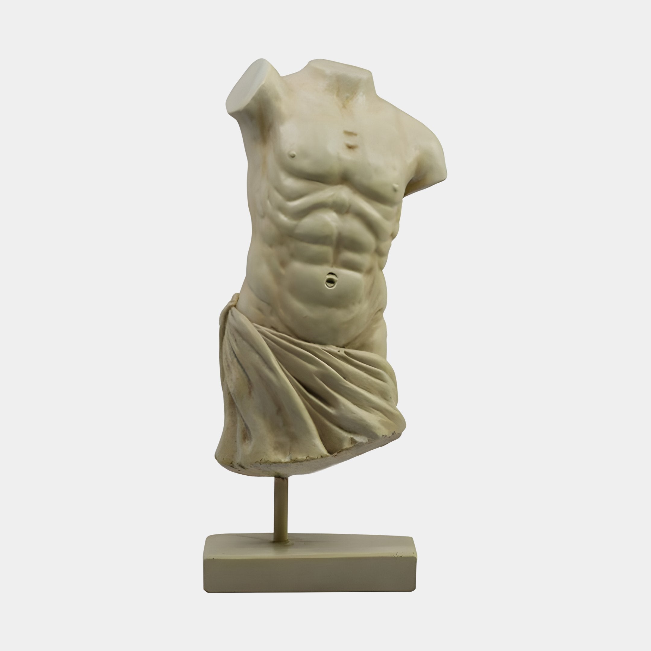 The Draped Male Marble Torso Sculpture - 120cm by Giant Sculptures is a classical-style torso without arms, head, or legs, draped at the hip and mounted on a rectangular base against a plain white background.