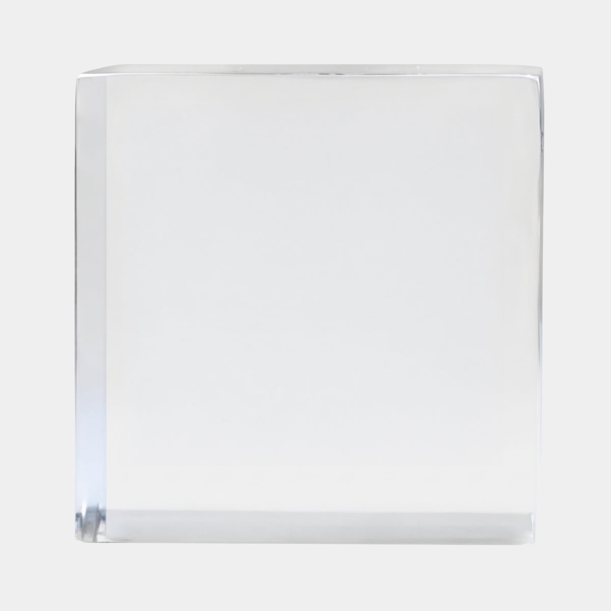 Clear Square-Edged Cast Cube Resin Sculpture - 10cm by Giant Sculptures, a transparent cube with crisp square edges, shown against a plain light background.