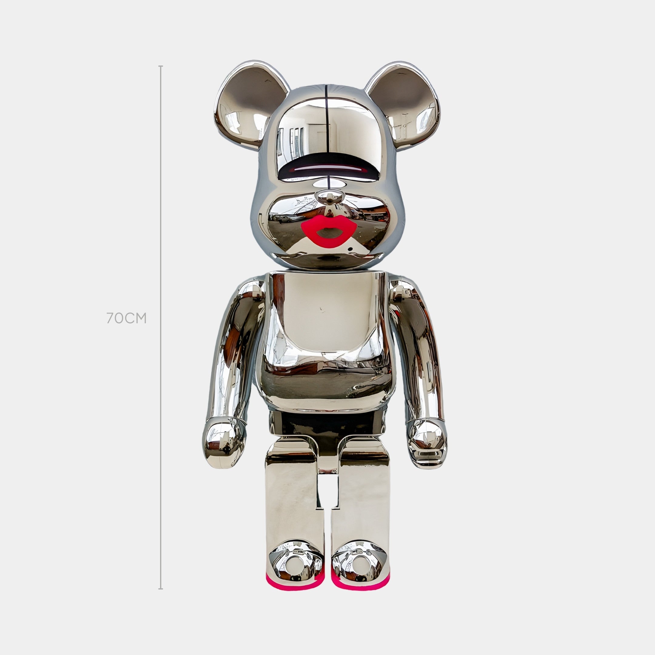 The Neon Kiss Chrome Bear Sculpture - 70cm by Giant Sculptures features a shiny, mirror-polished silver bear with red lips and pink feet accents, standing upright against a plain white background.