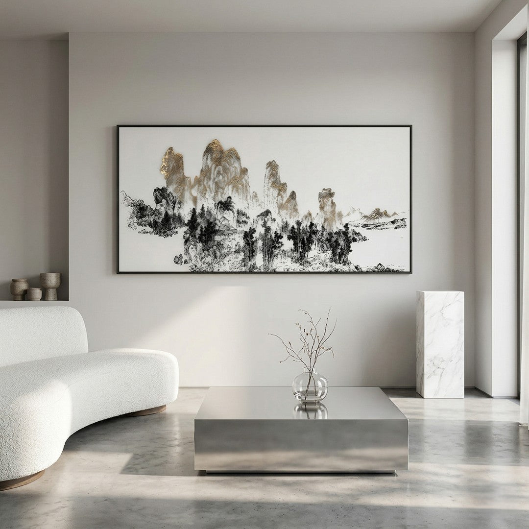Aureink Mountain Panorama Textured Silk 3D Wall Art by Giant Sculptures displayed in a minimalist living room above a white bouclé sofa, showing black ink mountains with gold-leaf accents in a brushed aluminium frame.