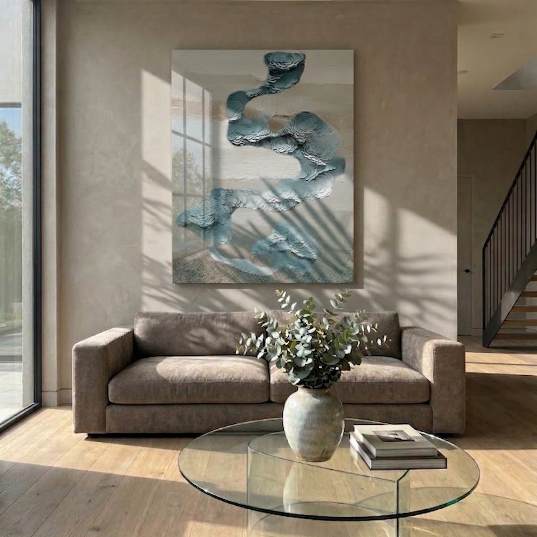 Aqualoom III Layered Leather Hand-Painted 3D Wall Art by Giant Sculptures in teal and white tones displayed above a taupe sofa in a sunlit living room with a glass coffee table.