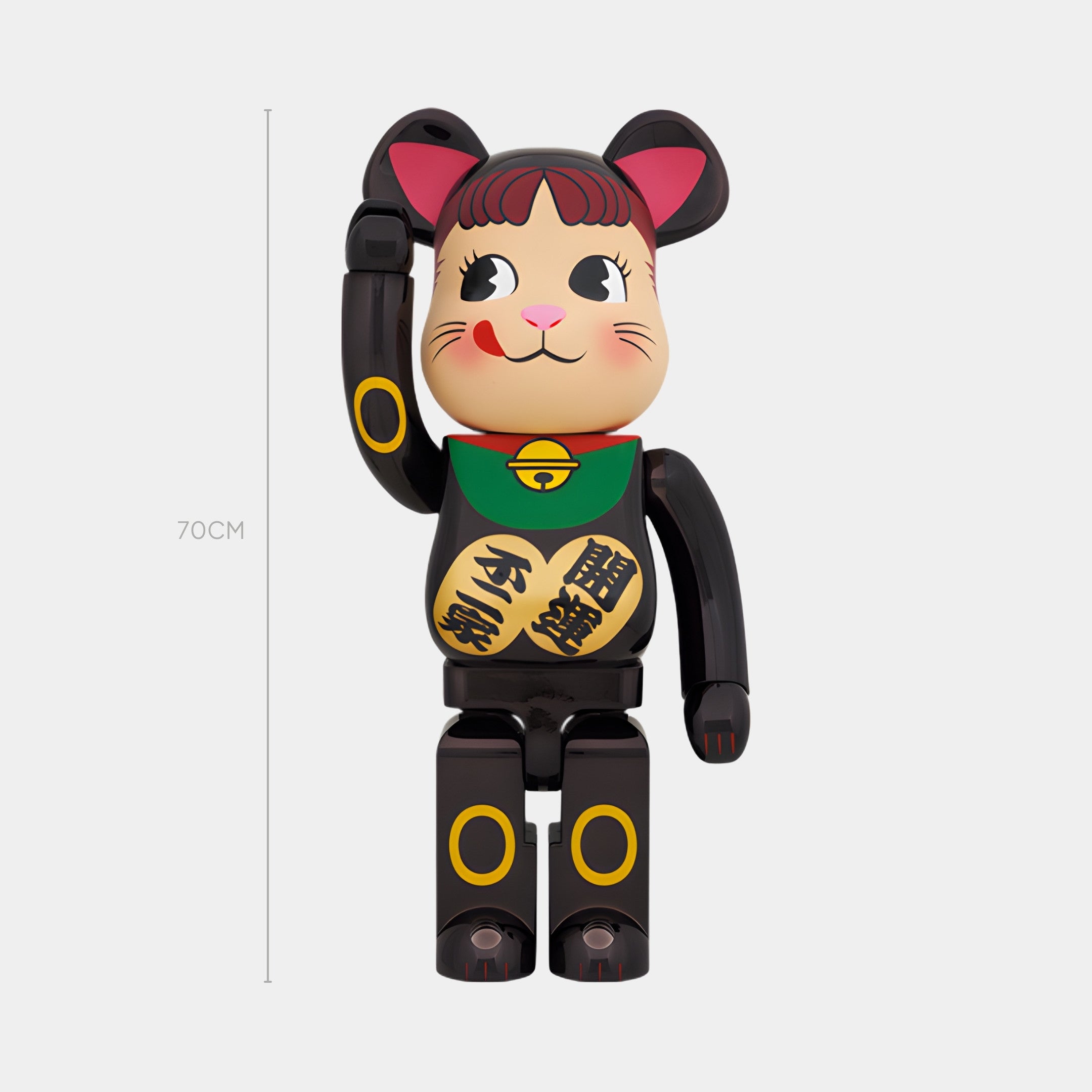 The Prosper Paw Black Bear Sculpture by Giant Sculptures is a 70cm-tall figure with a black body, pink ears, green bib, gold and black details, a raised paw, and a smiling face with red cheeks.