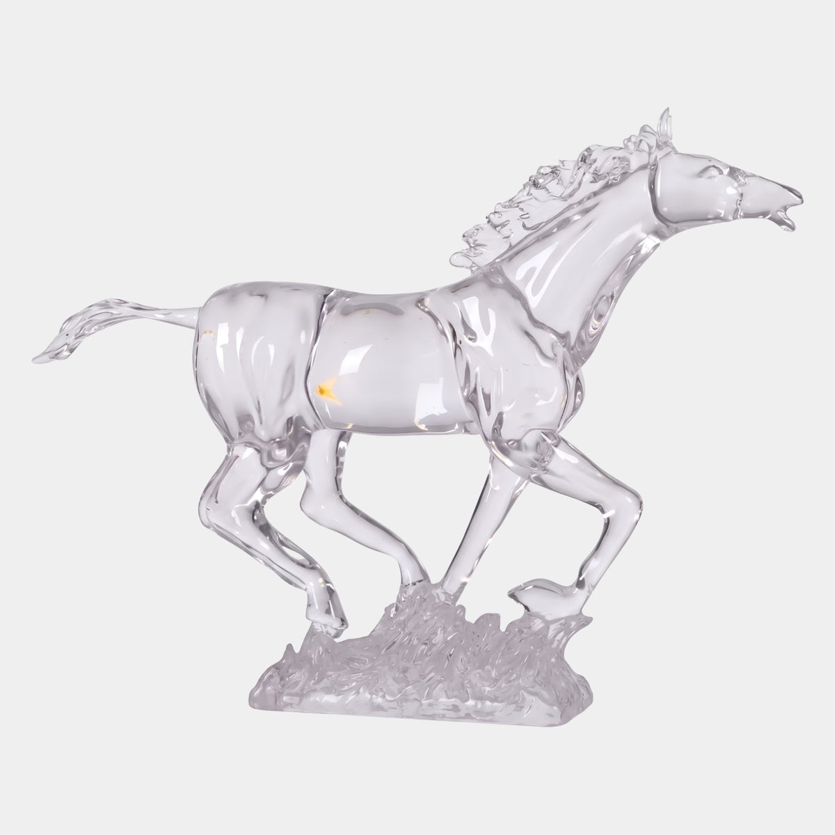 Clear Galloping Horse Cast Resin Sculpture, 84cm, shown mid-stride with hooves resting on clear tufted grass base, against a plain white background.