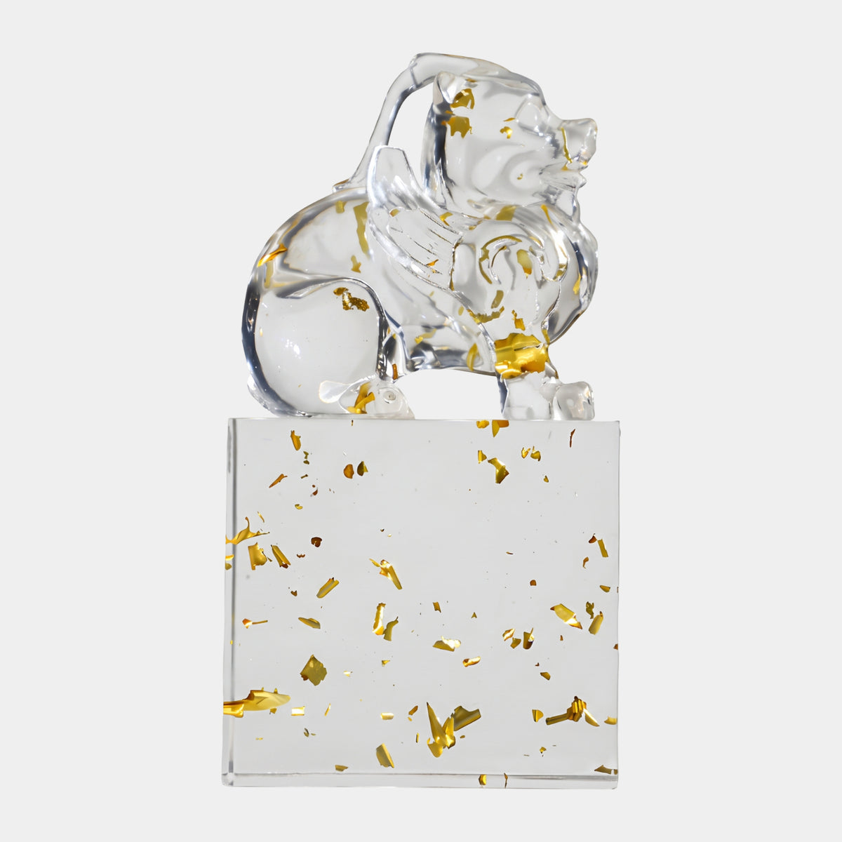 Clear Backward-Glancing Dog on Resin Block, 29cm, sitting with head turned over its shoulder, gold leaf flecks in both figure and base, on a plain white background.