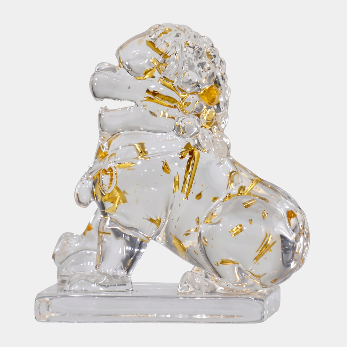 Clear Gold-Leaf Curly-Maned Guardian Lion Sculpture, 10cm, seated with head turned and mouth open, gold leaf flakes throughout resin, on a plain white background.