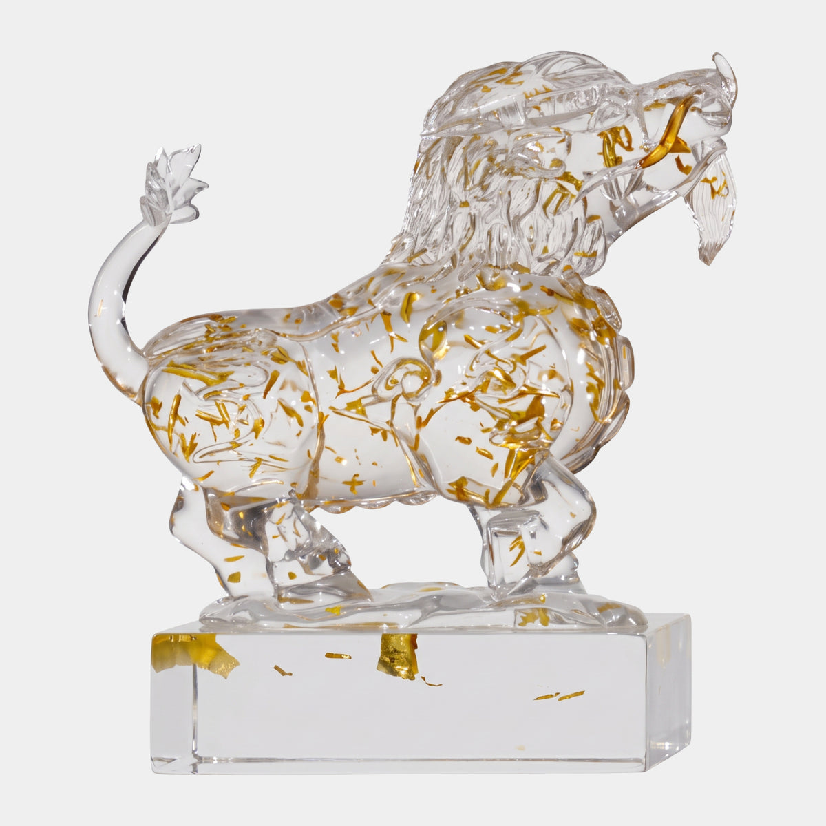 Clear Gold-Leaf Striding Beast on a Base - 20cm, a maned, horned creature with curled tail, gold flecks in clear resin, on a rectangular base against a plain white background.