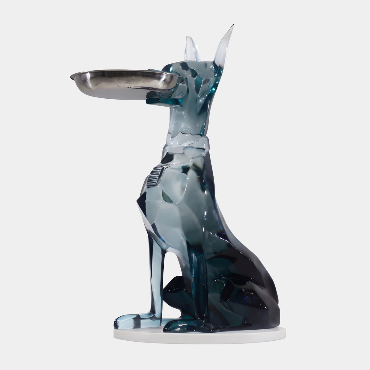 Blue Faceted Dog with Steel Tray Cast Resin Sculpture - 73cm, seated upright with pointed ears and a steel tray held in its muzzle, on a round white base against a plain light background.