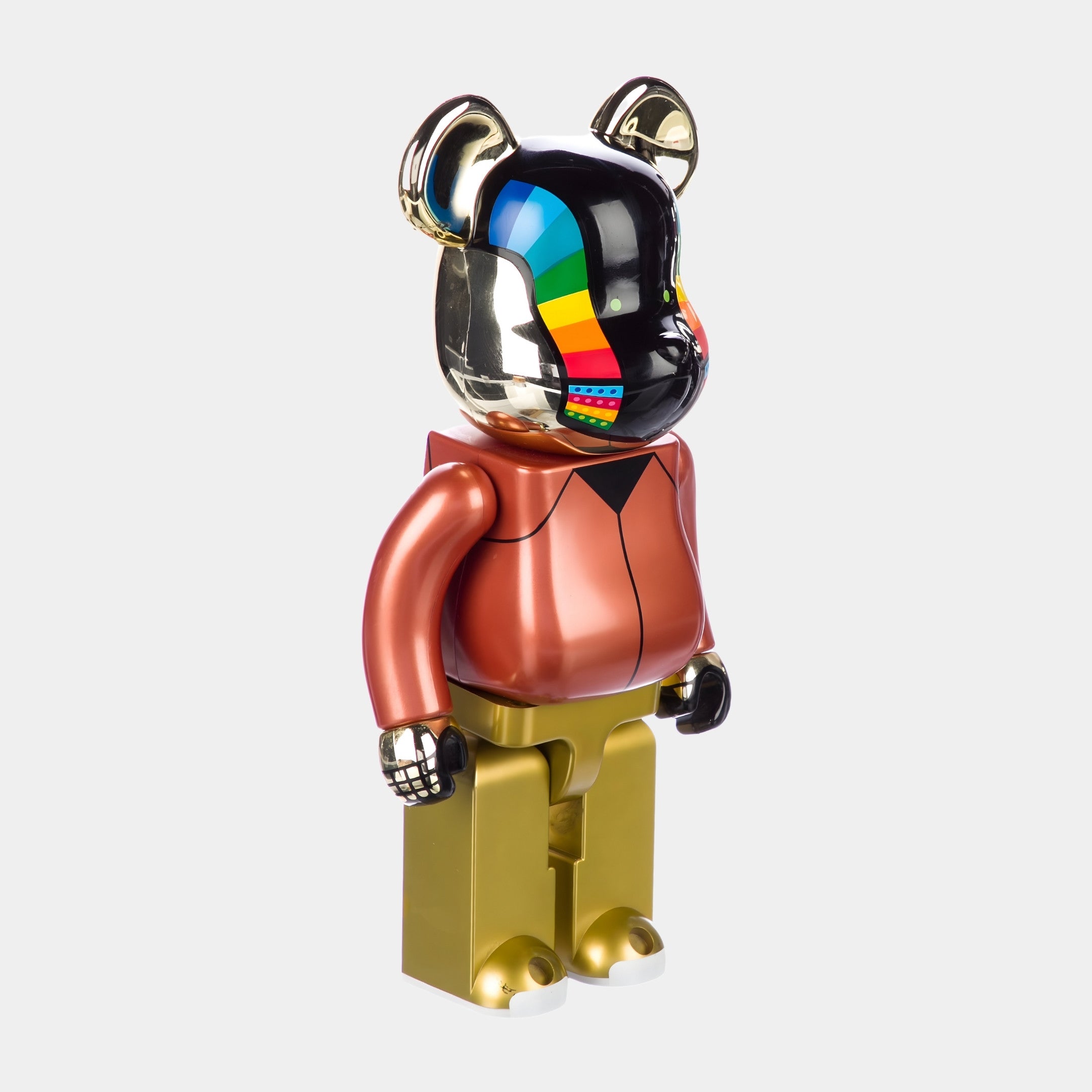 The Rainbow Drip Black Bear Sculpture - 70cm by Giant Sculptures features a glossy black and gold body, shiny gold face, colorful patterns, metallic brown torso, gold legs, and a glossy red and black arm.