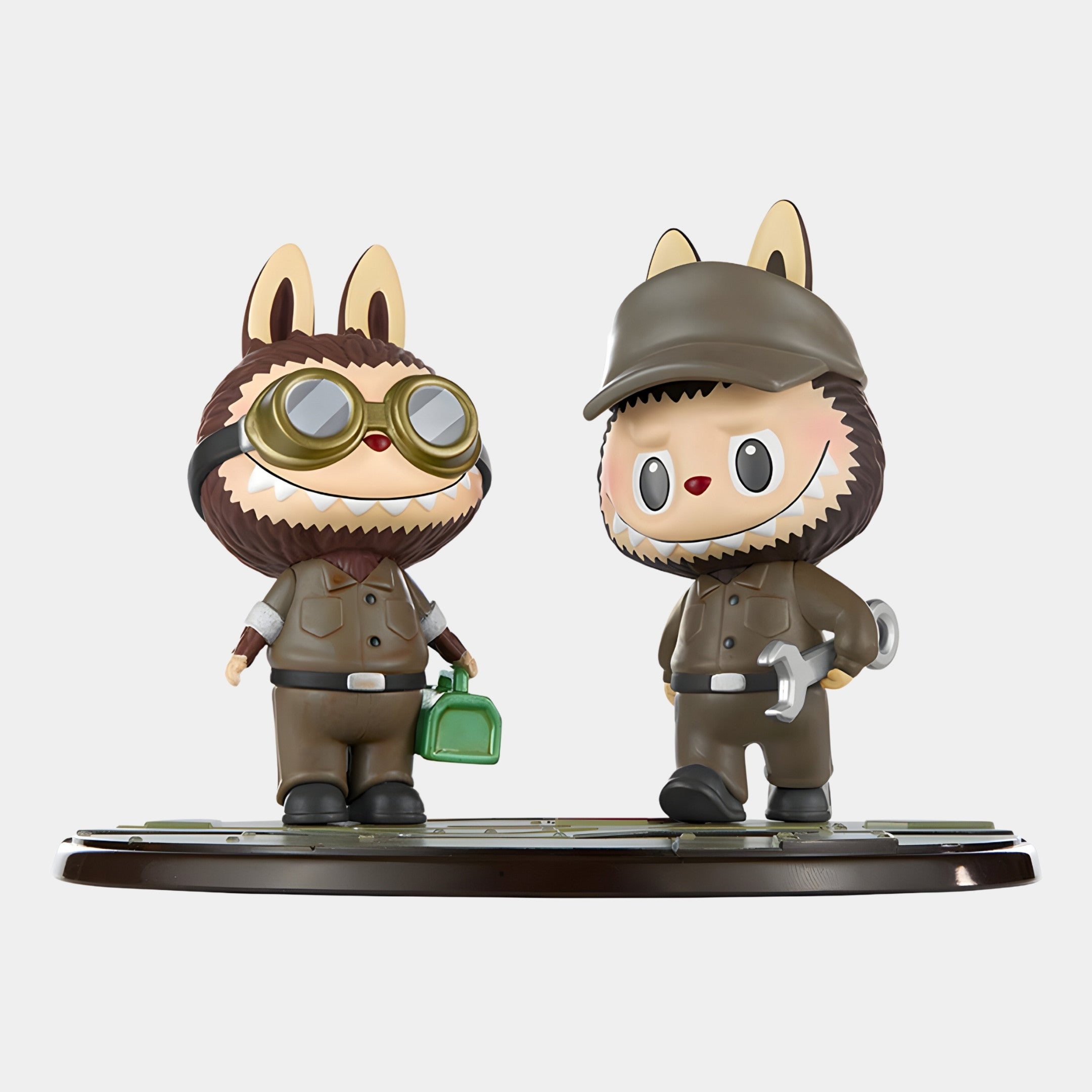 The Workshop Crew Labubu Mecha Sculpture (160cm) by Giant Sculptures features two playful characters in brown outfits, with animal ears and tails—one holding a green toolbox, the other a wrench—showcasing imaginative design.