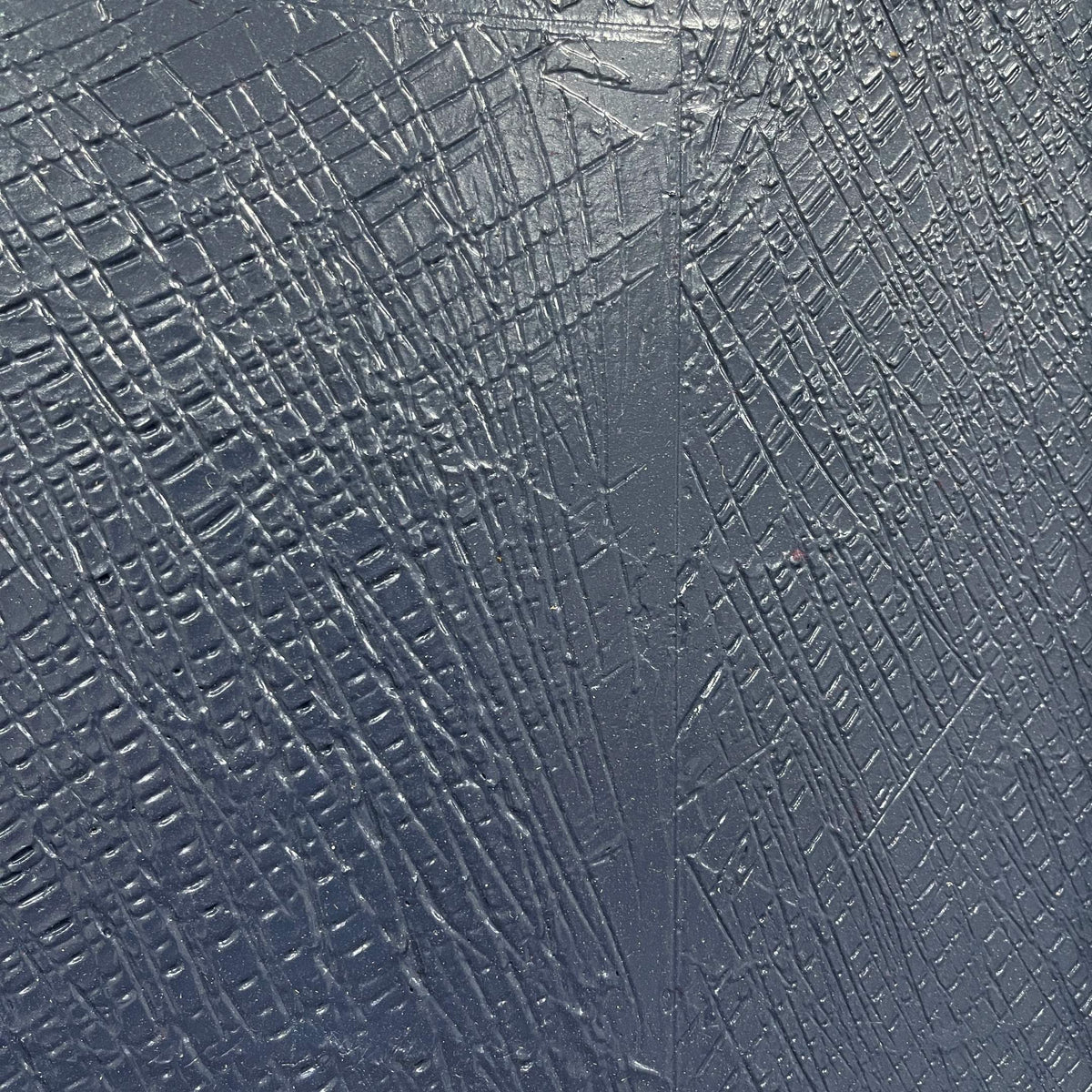 Close-up of Rivura Navy Layered Sandstone Texture 3D Wall Art showing crosshatched navy surface texture with a vertical seam and raised geometric grid pattern.