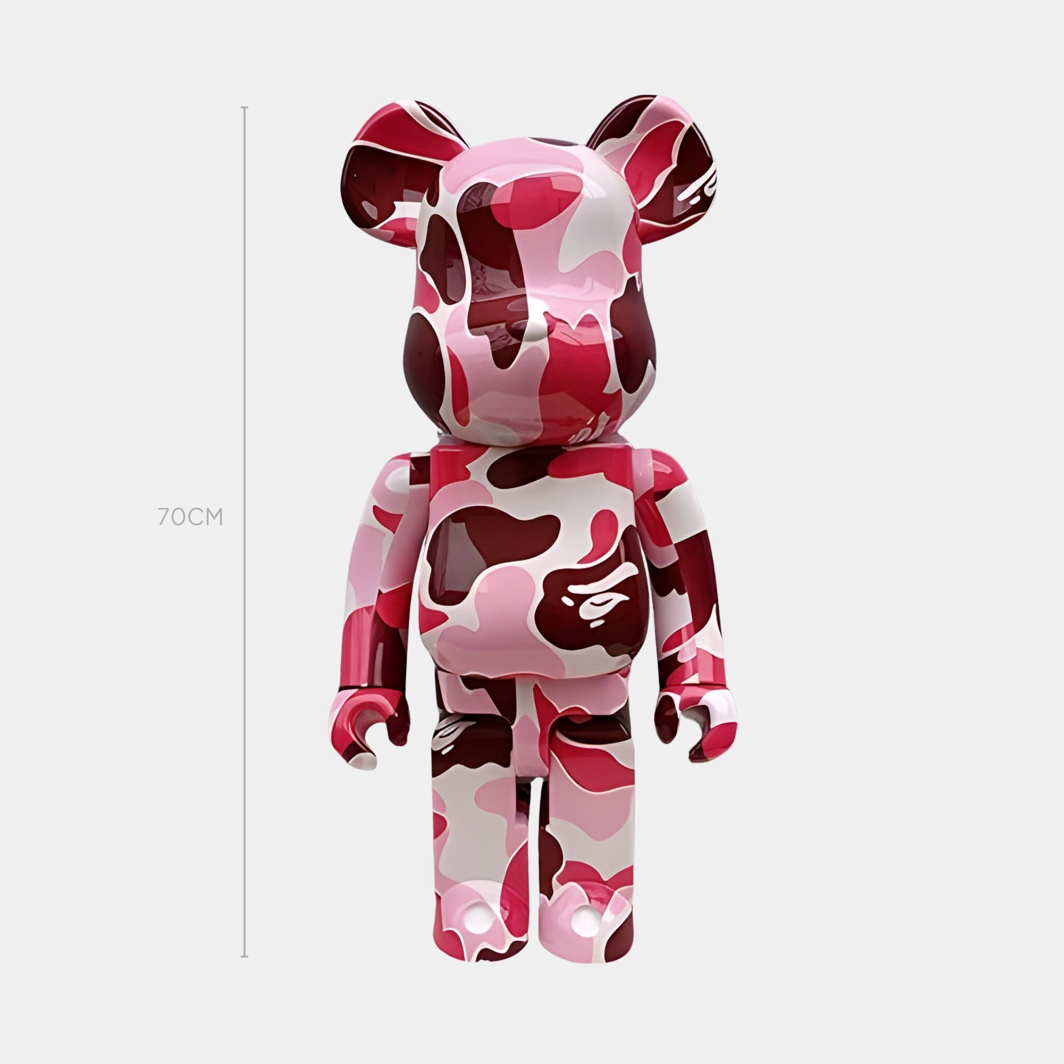 The Roseate Drift Bear Sculpture - 70cm by Giant Sculptures features a high-gloss pink-camo finish in pink, red, and white tones, displayed against a plain light background.