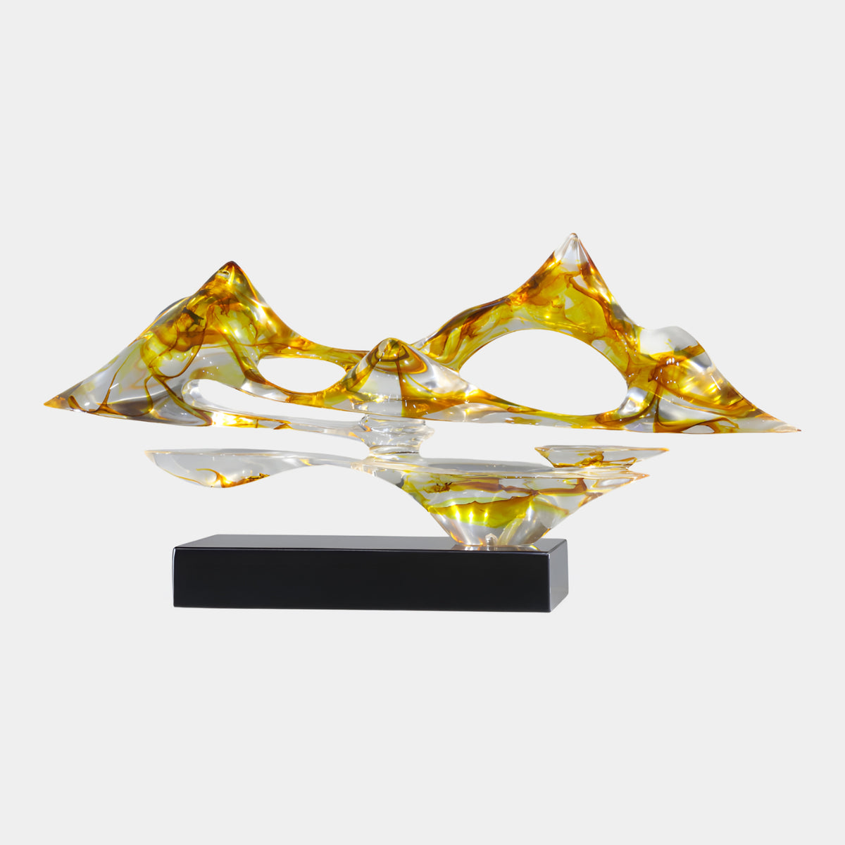 Amber Mountain & Reflection Resin Sculpture (85cm) with amber and orange swirled peaks over a mirrored reflection, pierced openings, set on a black marble base against a plain light background.