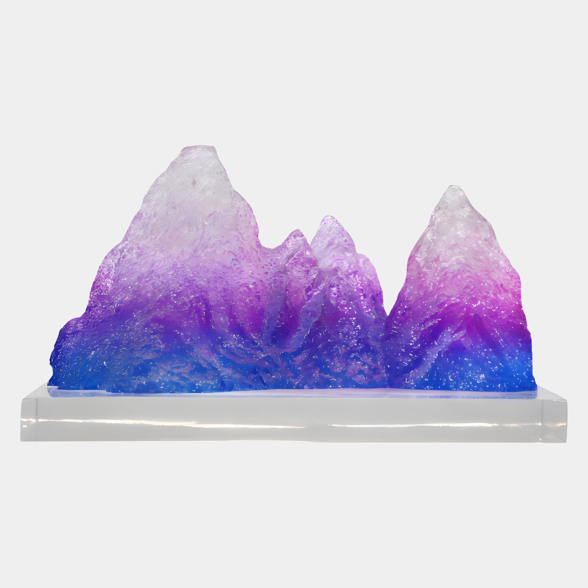 Purple & Blue Graded Mountain Resin Sculpture - 65cm, four frosted peaks shading from blue base to purple and pale summits, set on a clear acrylic block against a plain white background.