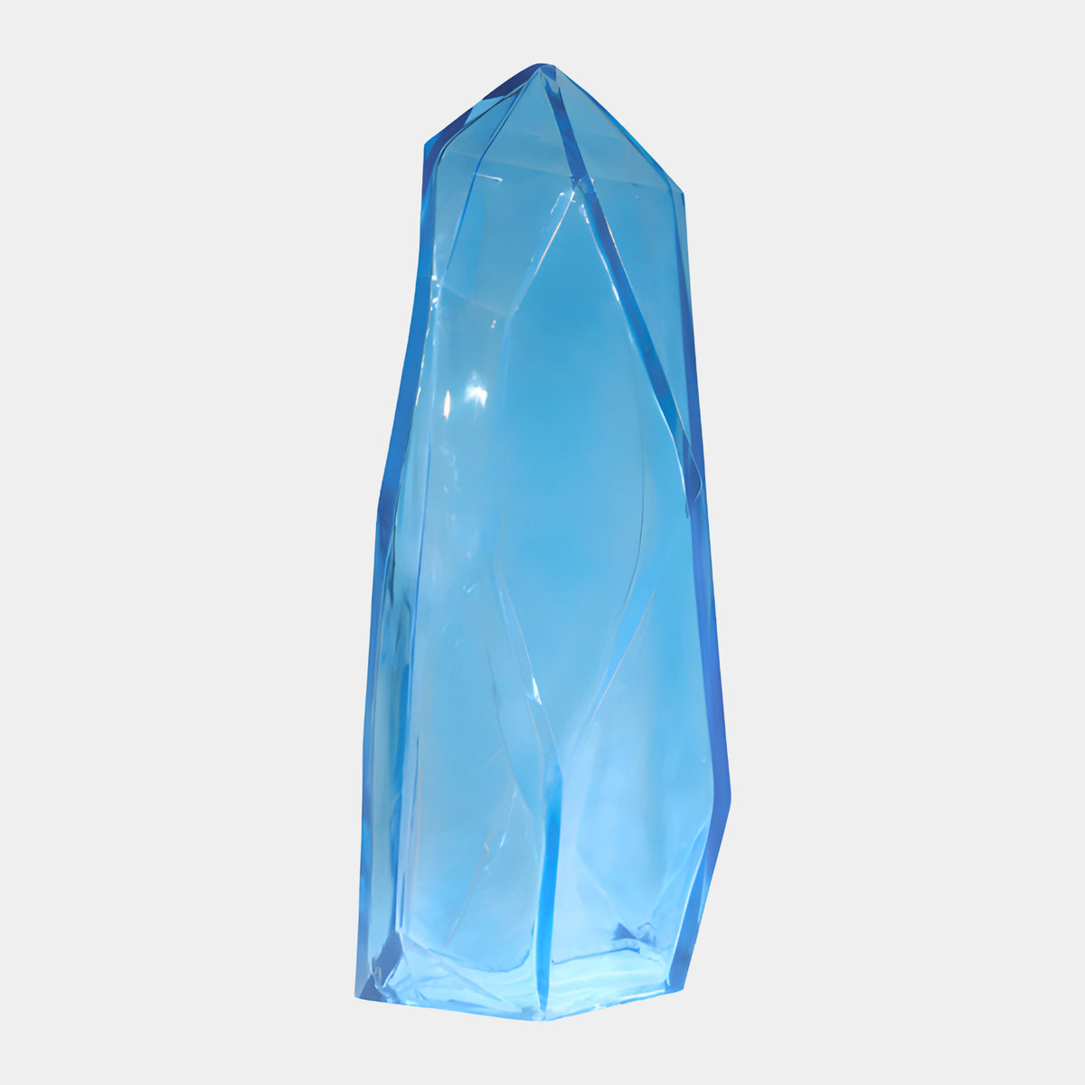 Blue Faceted Crystal Column Lit Resin Sculpture - 100cm, a tall faceted blue resin crystal tapering to a point, shown on a plain white background.