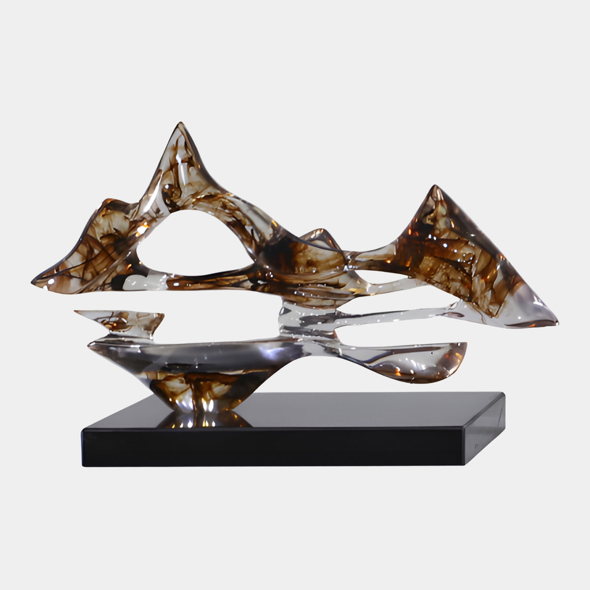 Clear Brown Ink Pierced Mountain Resin Sculpture, 45cm, with pierced peaks and a curved base on a black marble stand, set against a plain white background.