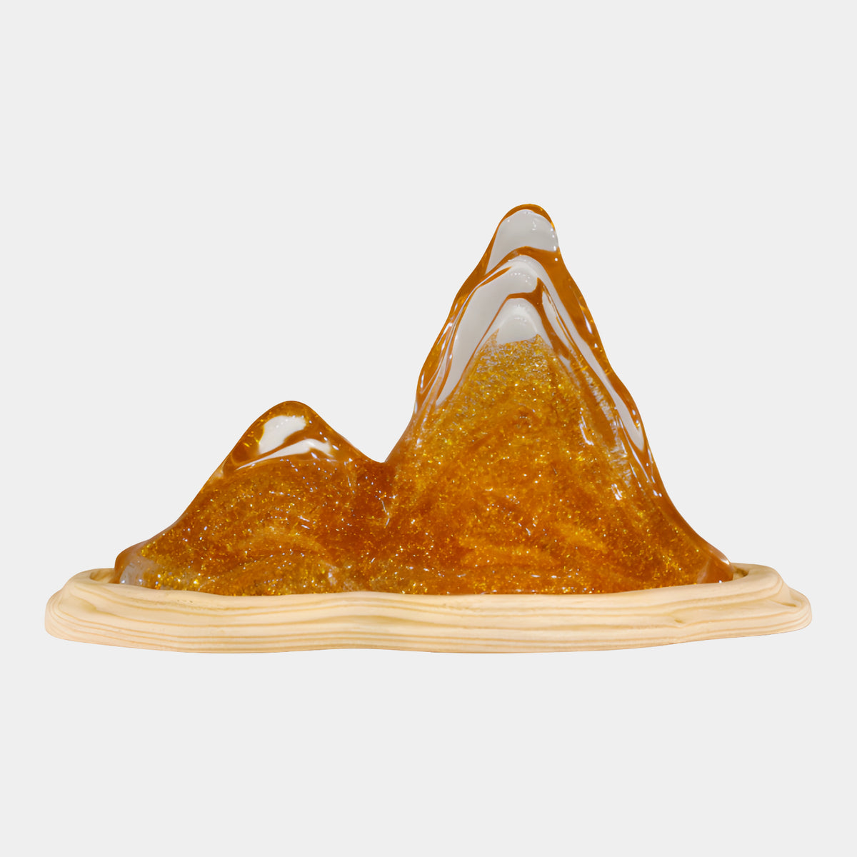 Amber Gold Dust Twin Peak Mountain Resin Sculpture, 30cm, twin amber peaks with gold-dust interior on a pale ash wood dish, shown on a plain white background.