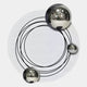 Three shiny silver spheres rest on a white surface with black concentric rings, forming the Astryn Chrome Orbit Round Textured 3D Wall Art by Giant Sculptures, evoking an abstract atomic model.