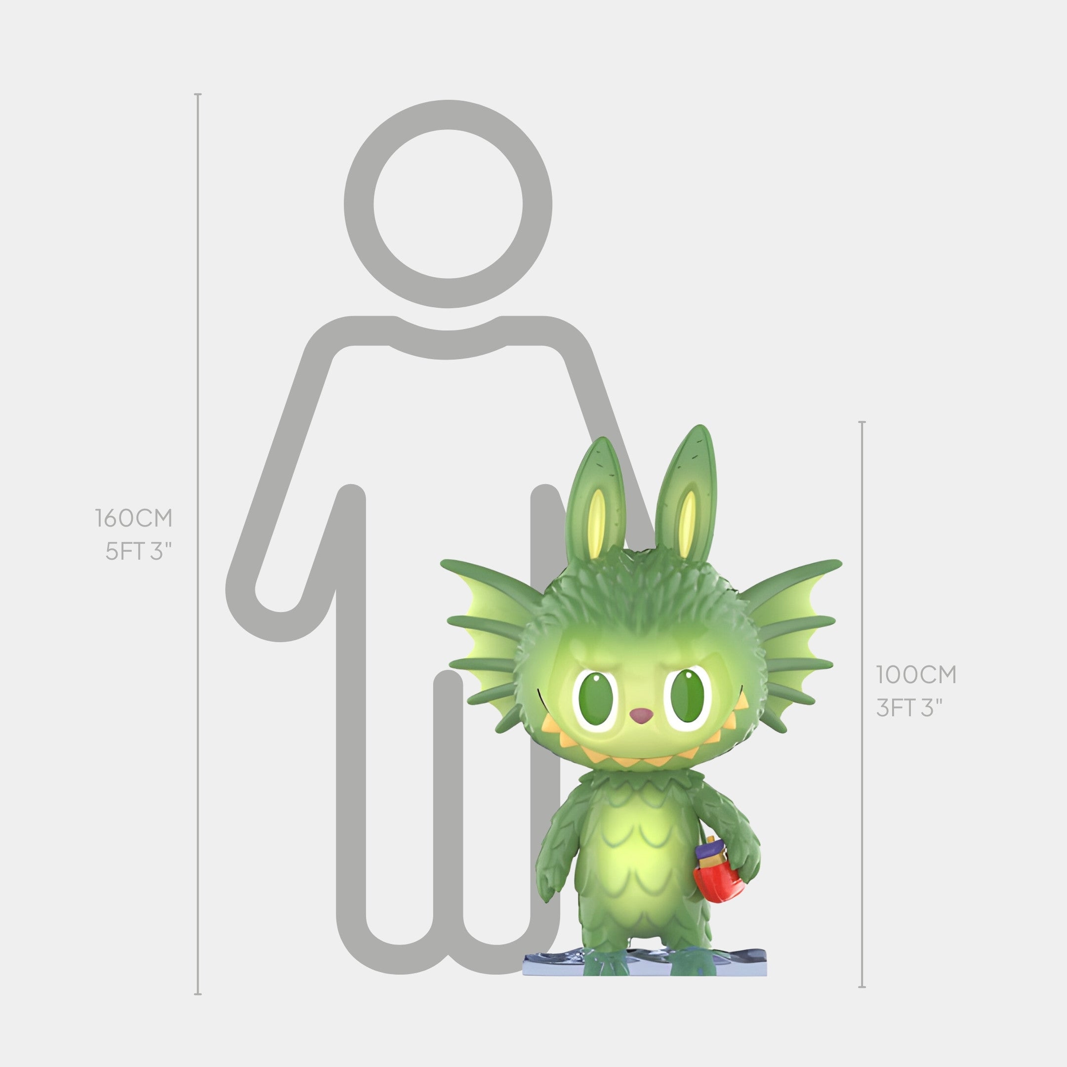 A green, spiky-eared Monsterverse Sea Dragon Labubu Sculpture by Giant Sculptures, standing about 100cm (3 ft 3 in) tall, holds a small object before a grayscale outline of a person labeled as 160cm (5 ft 3 in) tall.