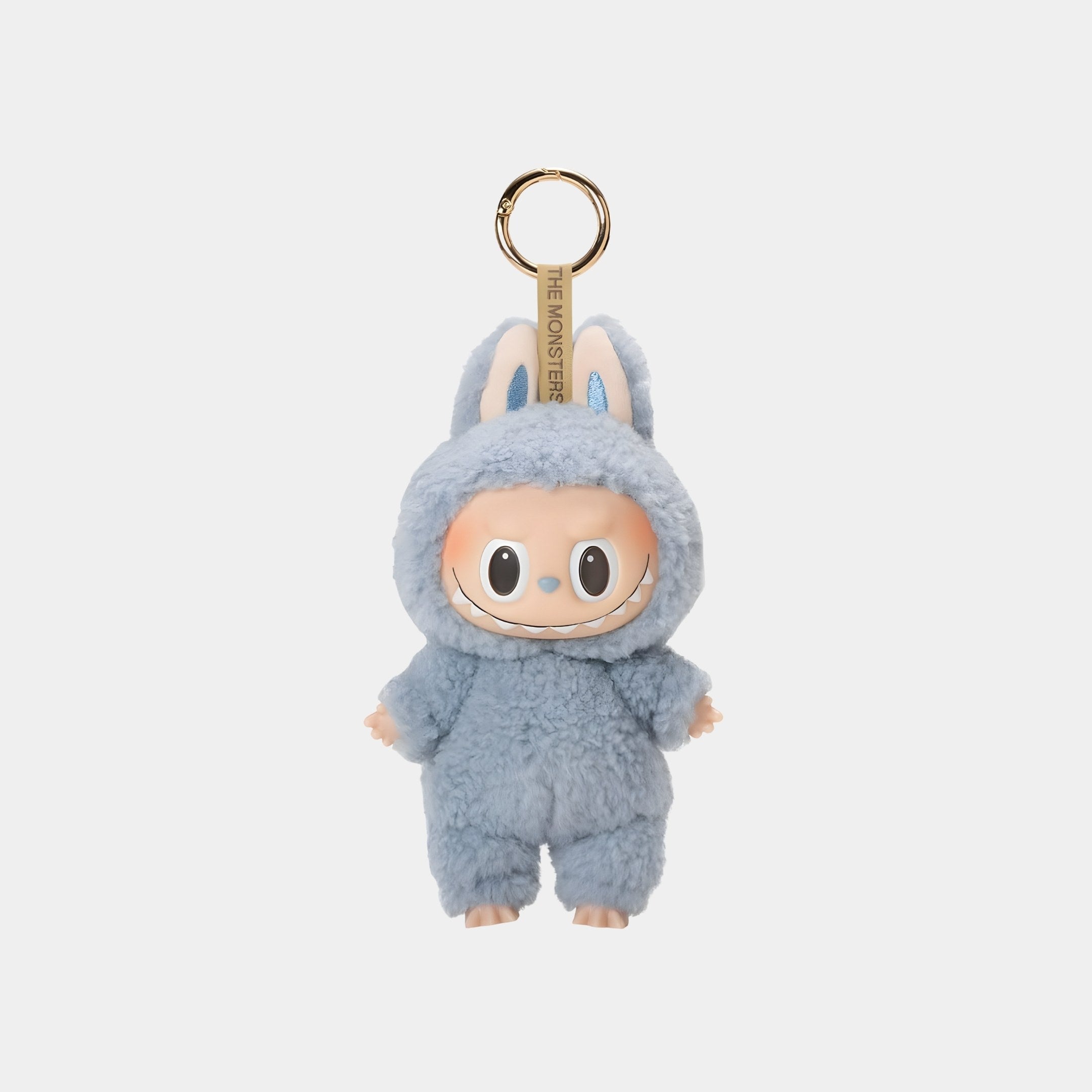 The Sea Salt Coconut Macaron Labubu Keychain Figure by Giant Sculptures is a 15cm plush keychain featuring a big-eyed, smiling doll in a fluffy blue bunny outfit with ears and a gold keyring for a cute accessory accent.