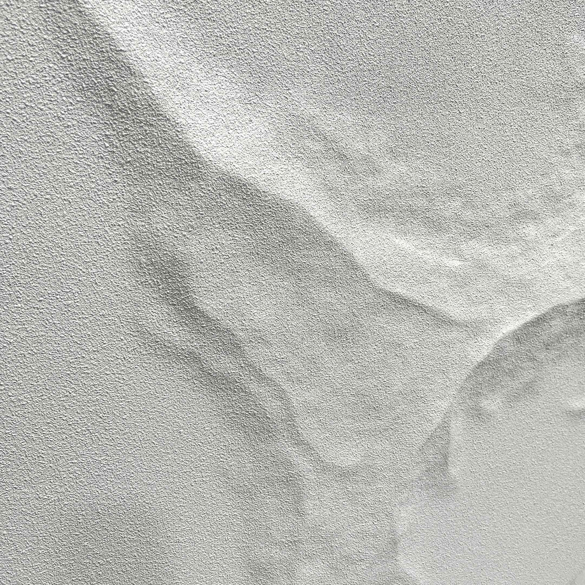 Close-up of the Selene V White Sandstone Textured 3D Wood Relief Wall Art showing its rough, eroded white-stone surface with deep cracked ridges.