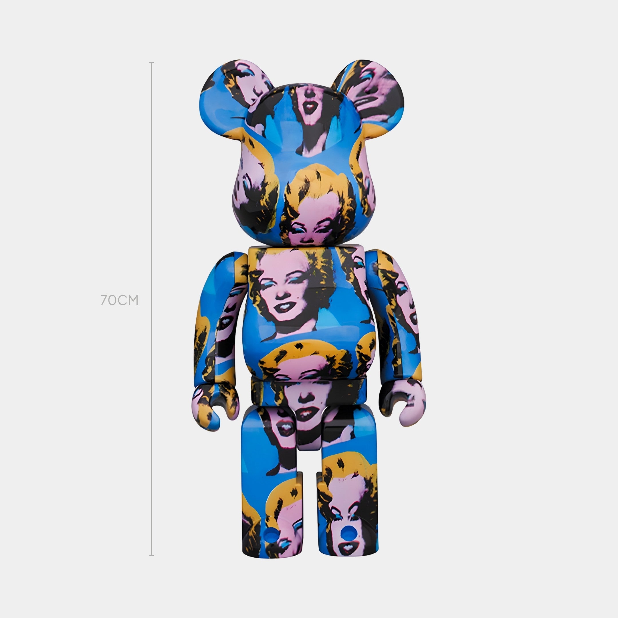 The Silkscreen Muse Bear Sculpture - 70cm by Giant Sculptures features a pop-art Marilyn Monroe design on a blue background, with bold colors and a cartoon-like style—ideal for adding a modern touch to your space.