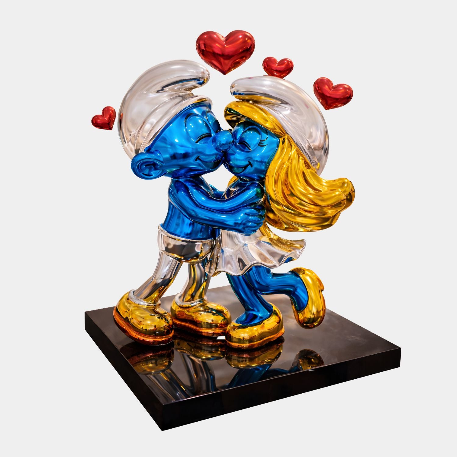 The Smurf Couple Kissing Love Sculpture - 60cm by Giant Sculptures features two Smurfs kissing on a black base with gold-detailed shoes and hair, topped with three red hearts—a vibrant pop art piece full of love and charm.