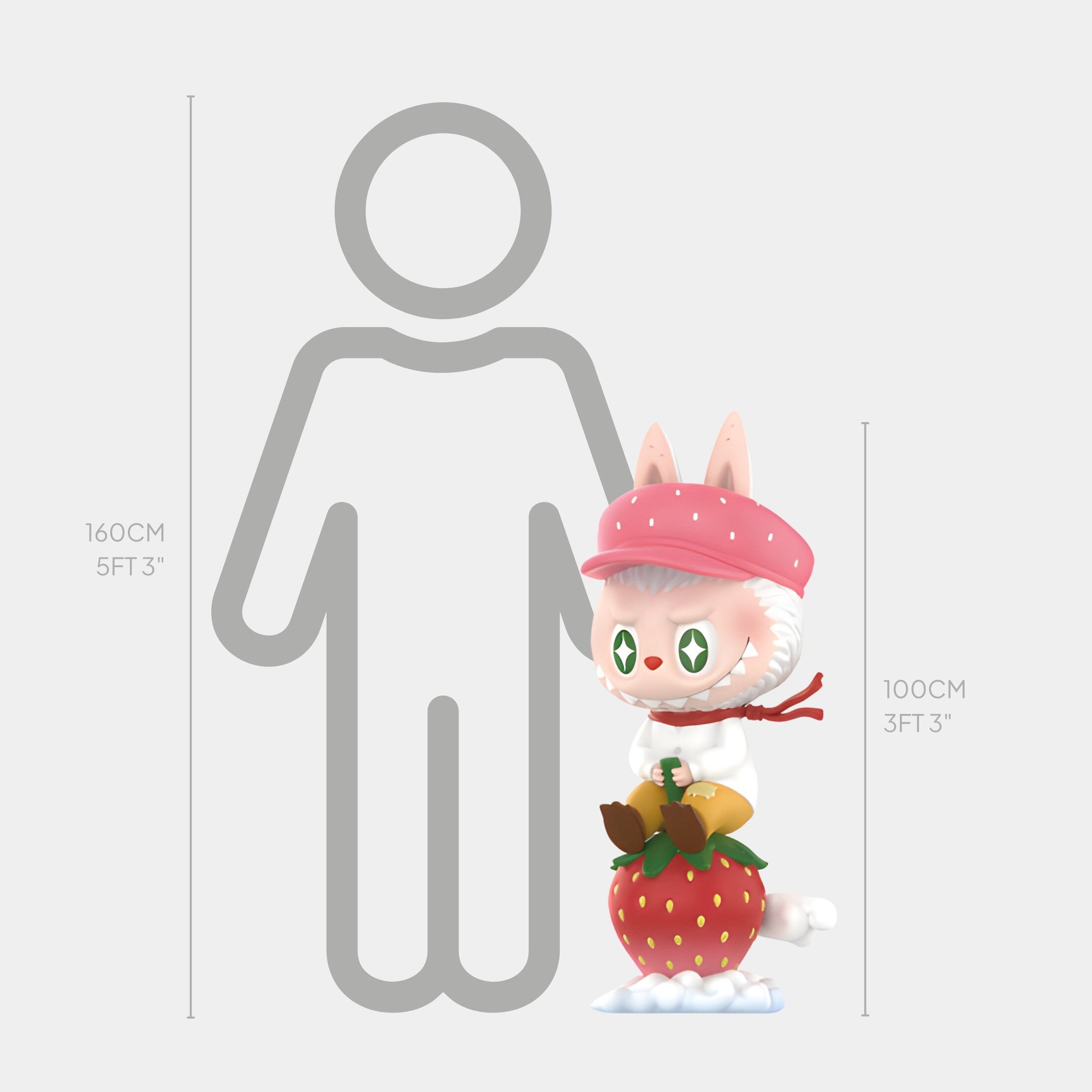 The Strawberry Fruit Labubu Sculpture - 100cm by Giant Sculptures features a cartoon bunny in a pink hat and scarf holding a strawberry, shown next to a gray human silhouette. This fiberglass piece adds charm to whimsical interiors.