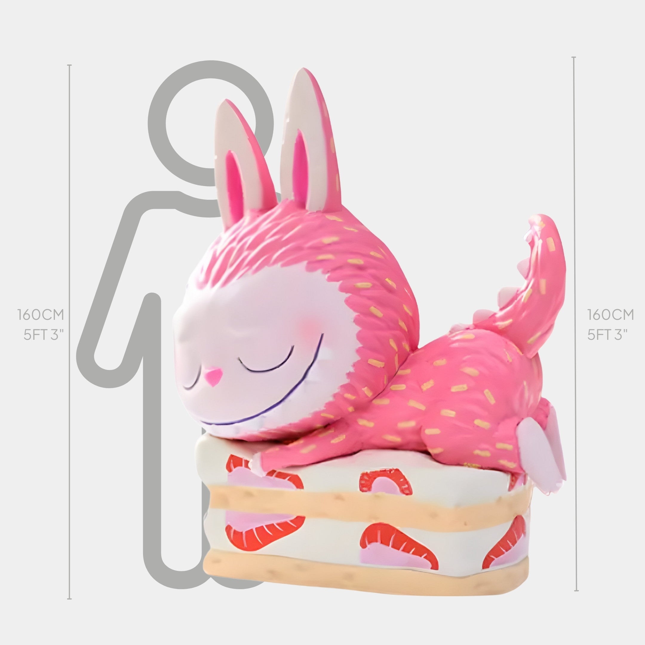 The Sweet Mischief Strawberry Cake Labubu Sculpture by Giant Sculptures stands 160cm tall, featuring a pink, smiling cartoon creature with bunny ears and a spiky tail—an ideal, whimsical display piece for your indoor space.