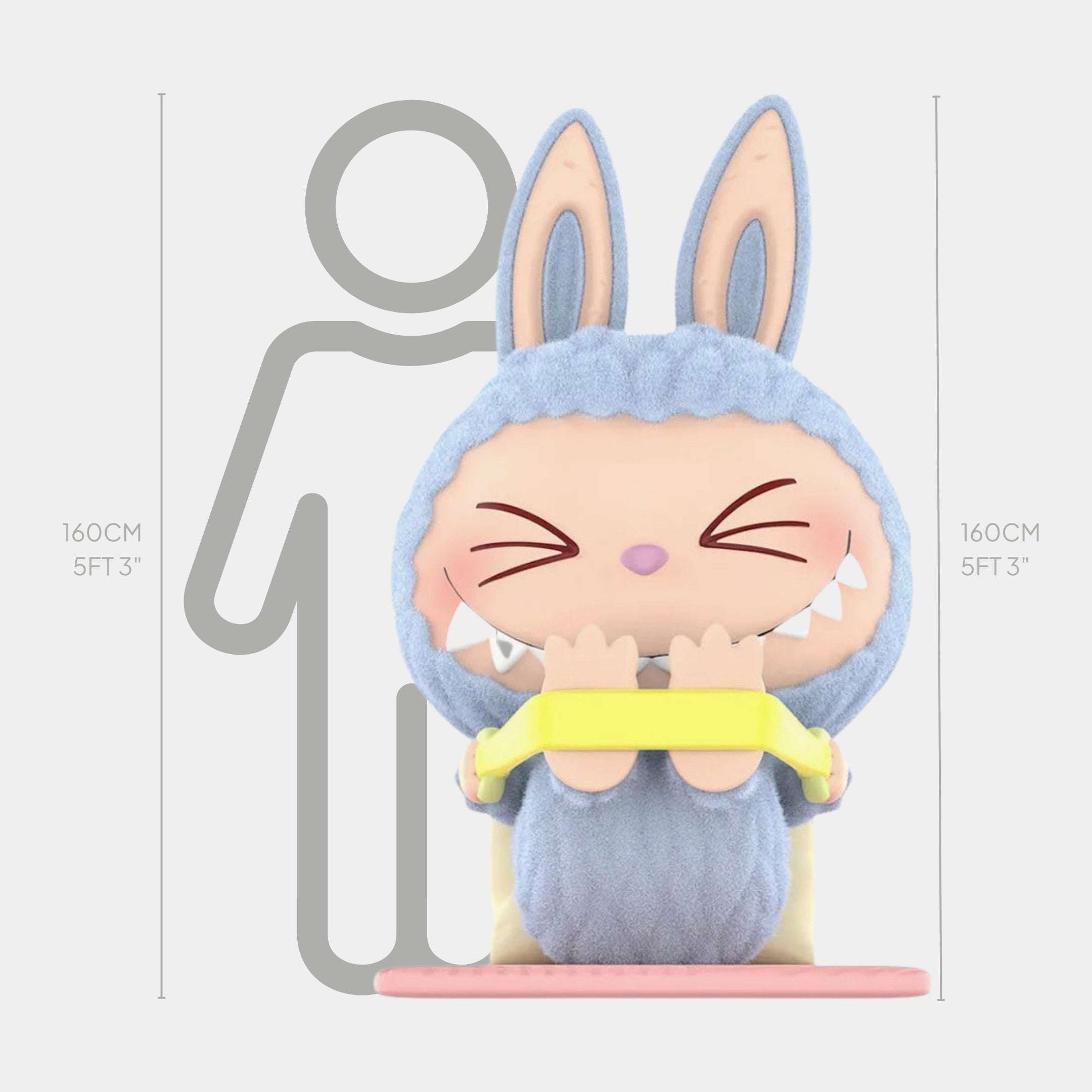 The Lazy Yoga Stretch Out Labubu Sculpture by Giant Sculptures stands 160 cm (5 ft 3 in) tall, featuring a bunny-eared figure blushing, holding a yellow resistance band, with a grey human outline in the background for scale.