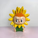 The 100cm Flower Elves Sunflower Labubu Sculpture by Giant Sculptures features a sunflower-headed character with orange hair, bunny ears, big red and white eyes, green shorts, and a small bee toy.