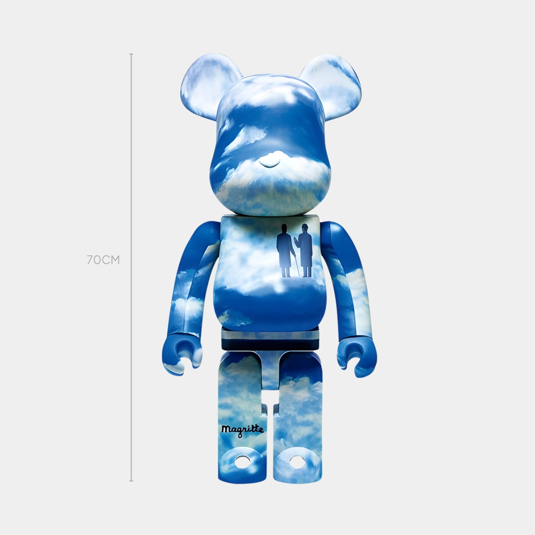 The Surreal Cloud Bear Sculpture - 70cm by Giant Sculptures features a dreamlike blue-and-white sky motif, silhouettes of two people, and Magritte on its leg, inspired by surrealist art.