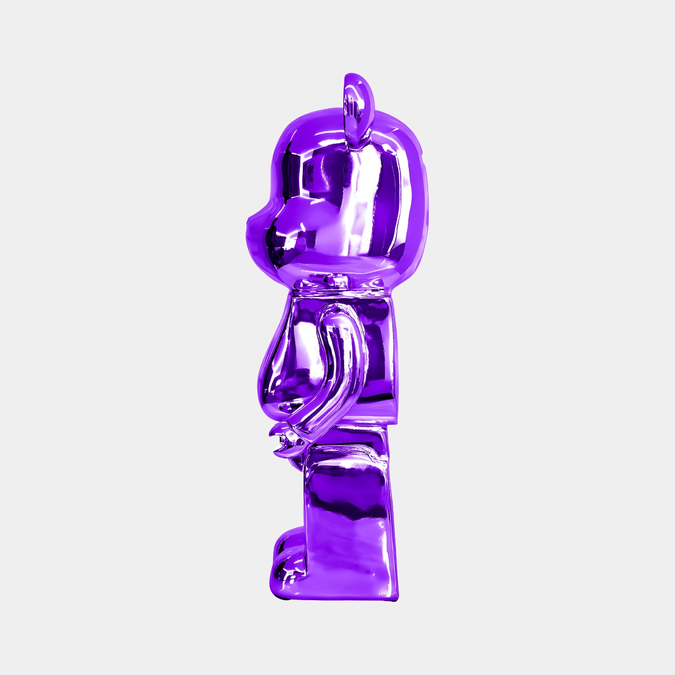 The Phantom Purple Bear Sculpture from Giant Sculptures, standing at 50cm, is displayed in side profile against a plain white background. Its sleek and shiny electroplated finish highlights the vibrant purple color, while the premium resin crafting lends it an elegant and captivating presence.