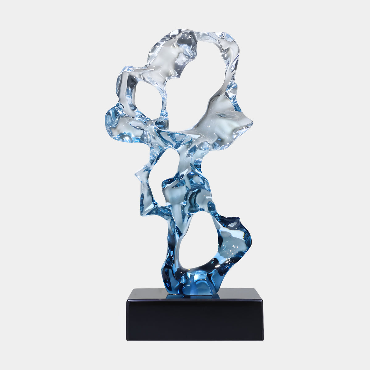 Blue Pierced Scholar's Rock Resin Sculpture, 47cm, pierced upright form fading from deep blue at the base to clear at the top, on a black marble base against a plain light grey background.