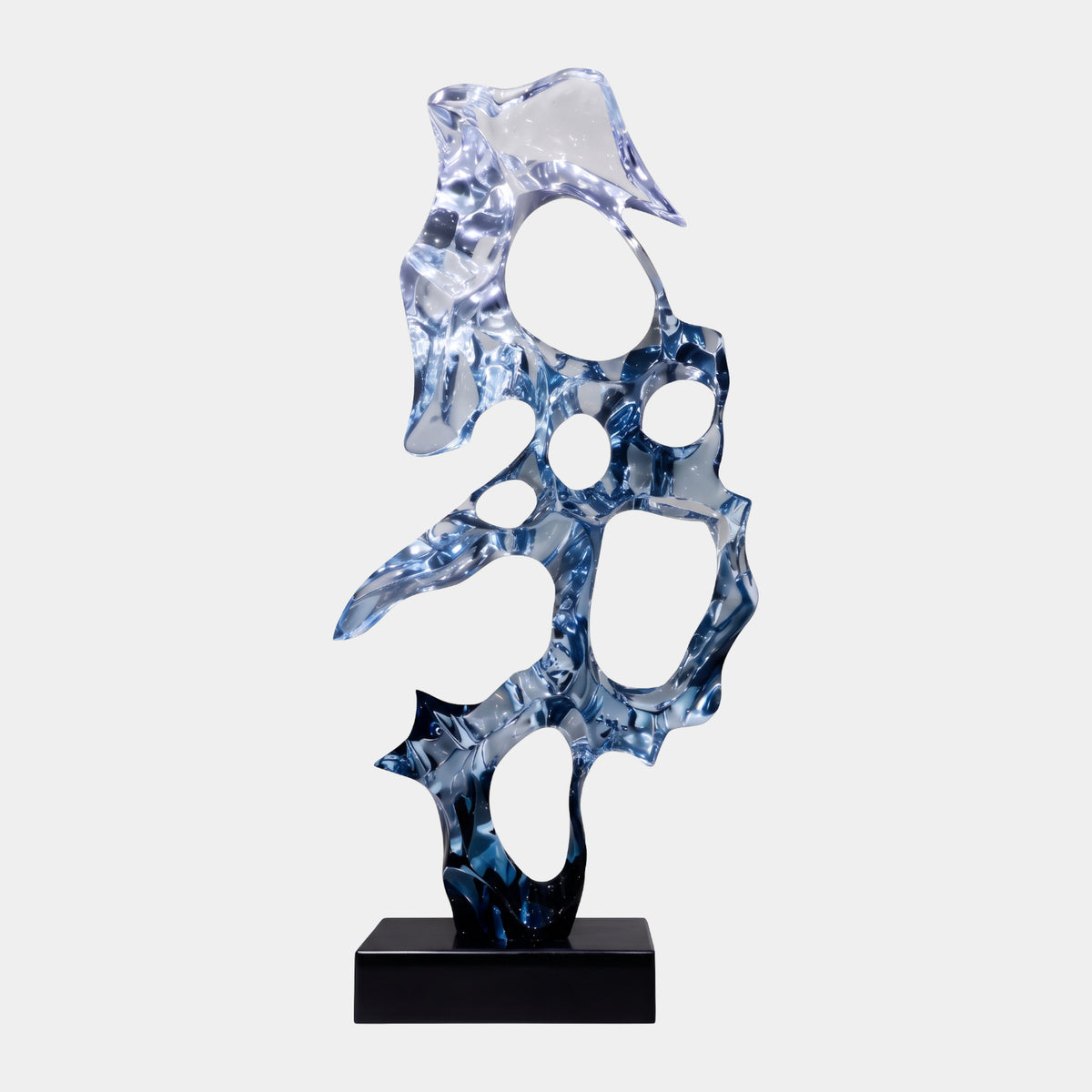Blue Graduated Pierced Fin Resin Sculpture, 83cm, with organic pierced openings shading from clear at the crown to deep blue at the base, on a black stand against a plain white background.